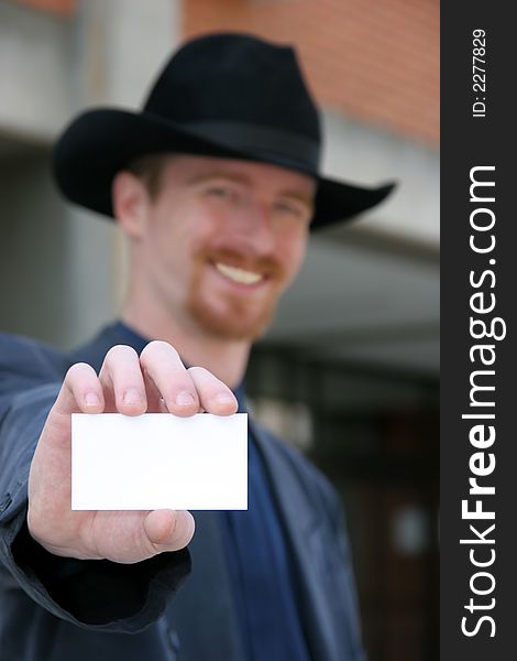A Businessman holding calling card