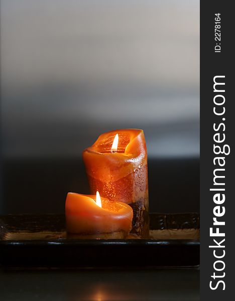 Two aromatic candles on counter top