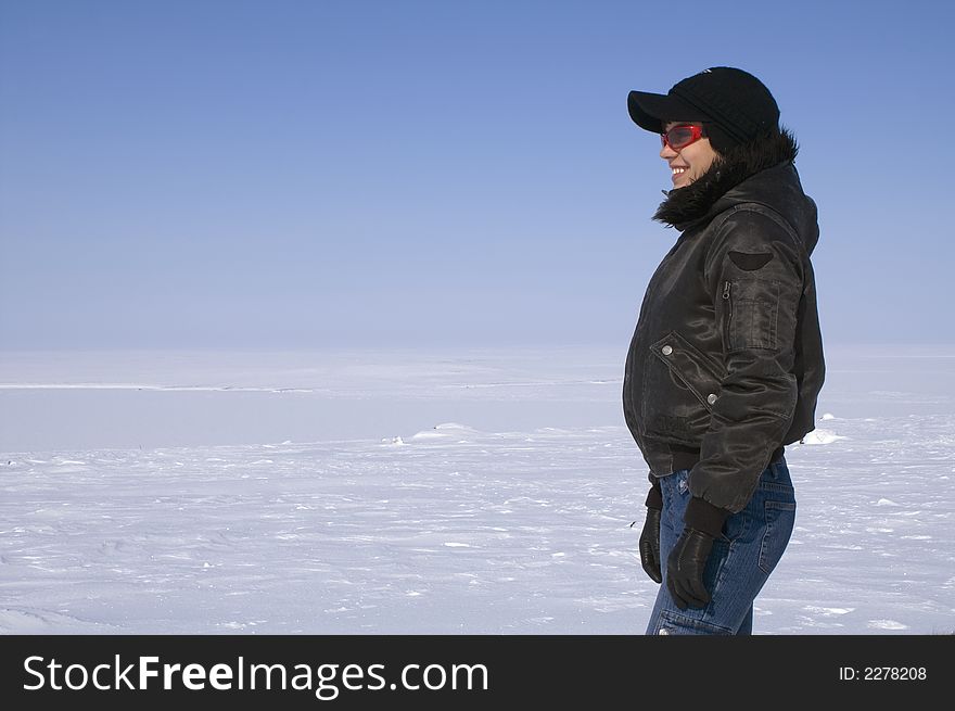 The young woman on a background of snow open space. The young woman on a background of snow open space