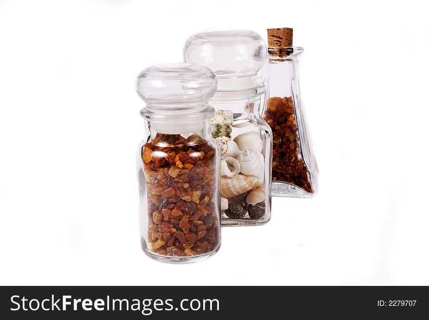 Amber and shells on white background