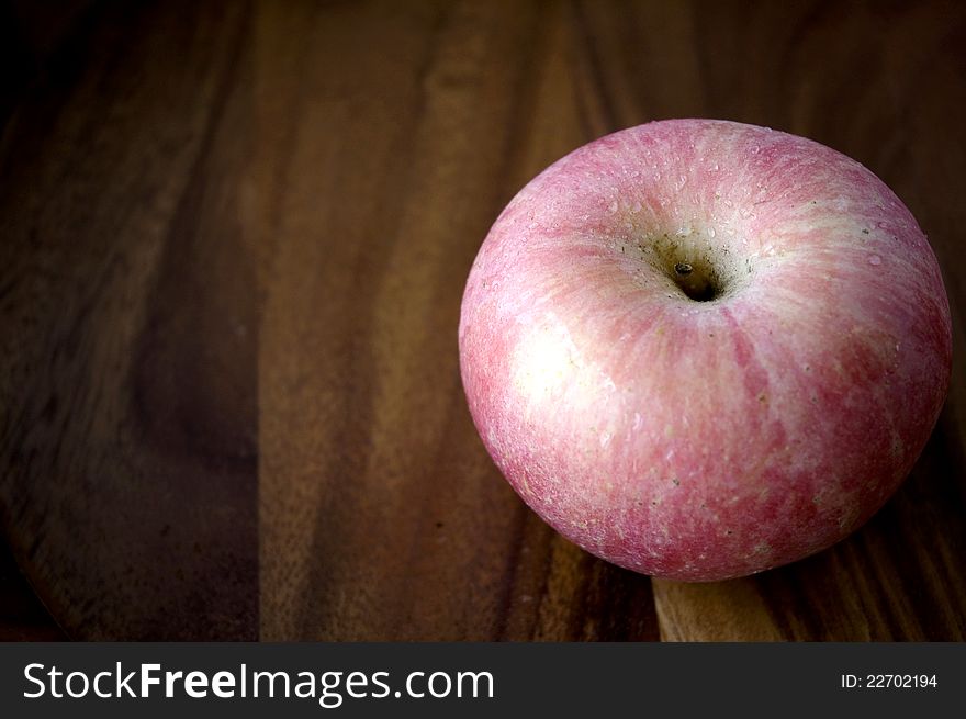 Apple On Wooden