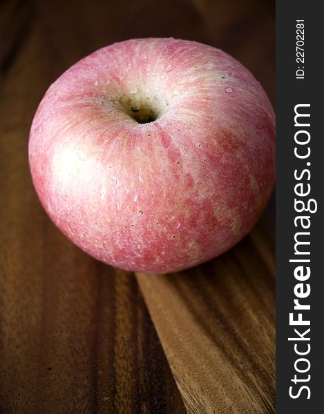 Pink Apple On Wooden Tray