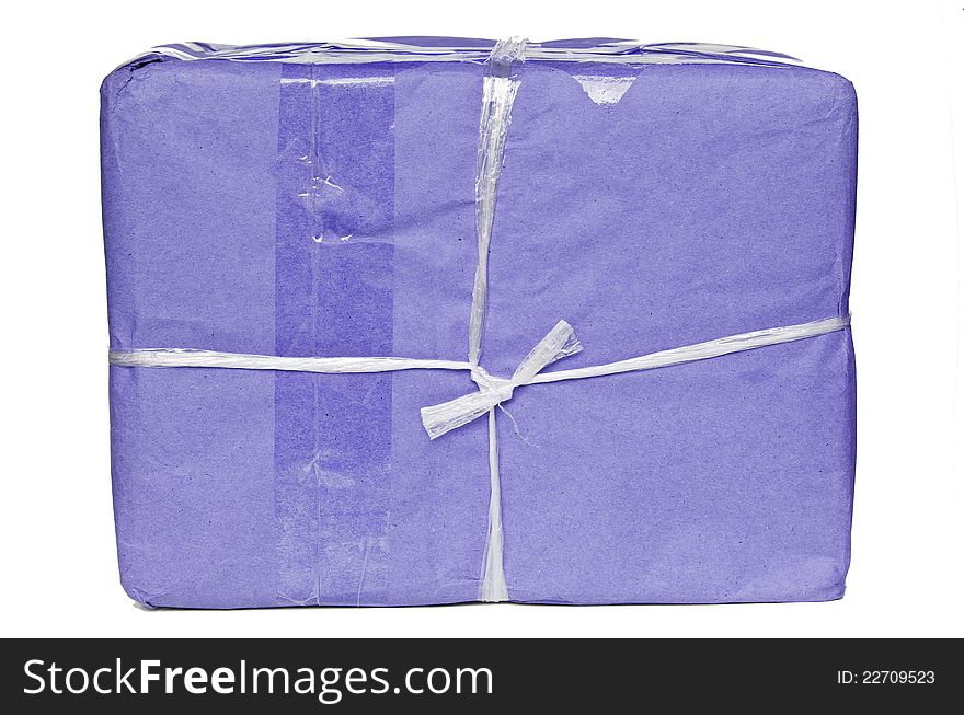 A parcel wrapped in purple paper and tied with rough twine and blank label,  on white background