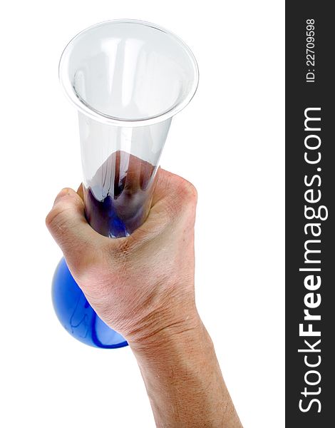 Hand is holding up a laboratory flask with blue liquid