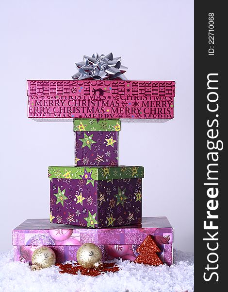 Colorful Christmas gifts with snow and christmas trees