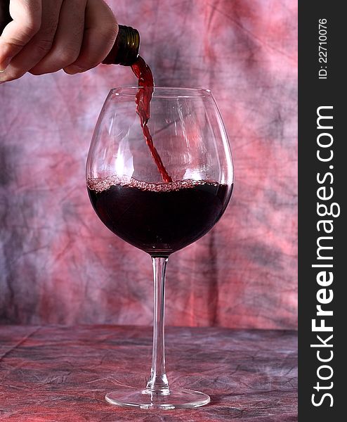 Red wine with red background