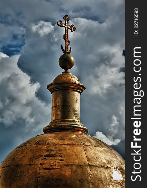 Golden dome of the church against the sky