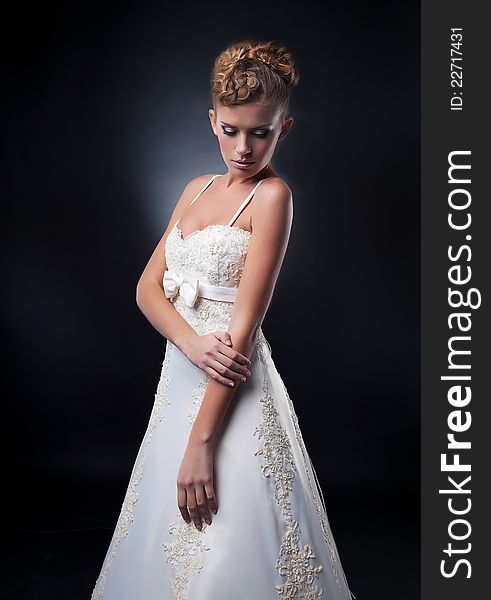 Supermodel fashion model posing in wedding dress