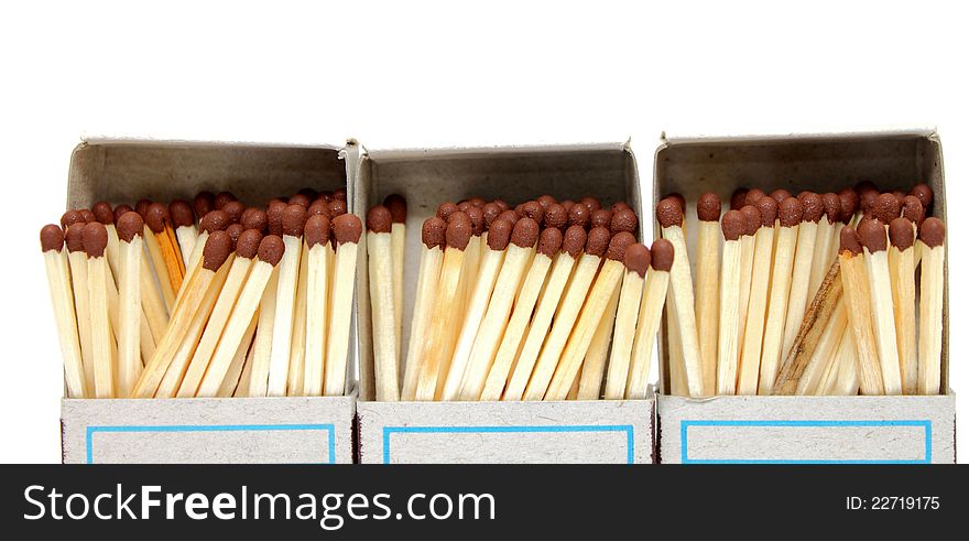 A lot of matches in a box on a white background