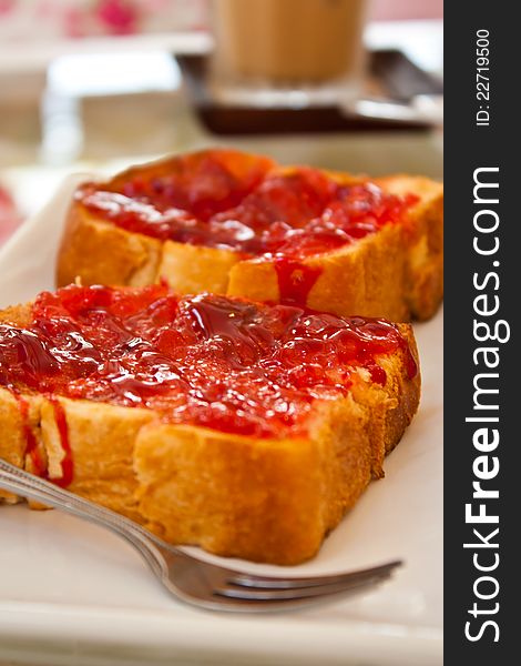 Slice of bread with red jam