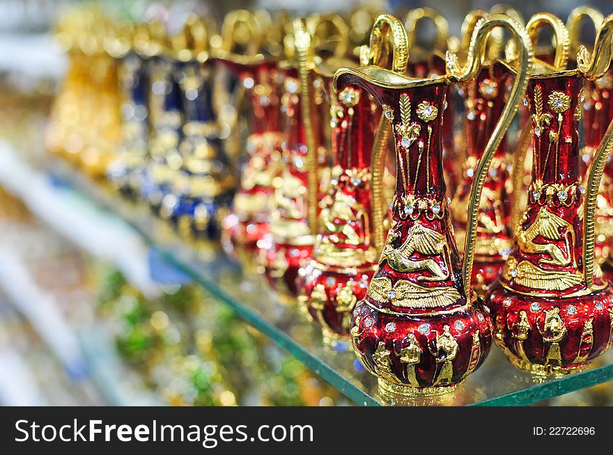 Antique arab blurred kettles on a shelf in a shop. Antique arab blurred kettles on a shelf in a shop