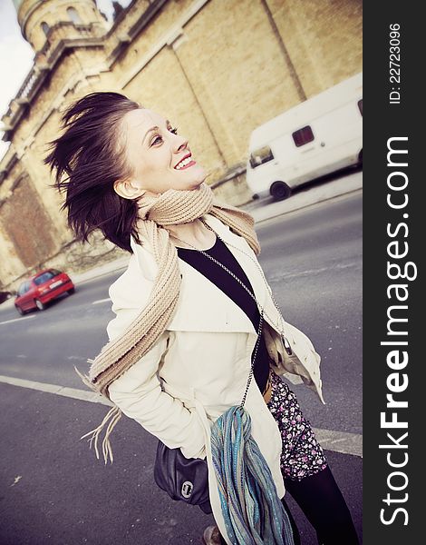 Young woman running in the city on the sidewalk. Young woman running in the city on the sidewalk