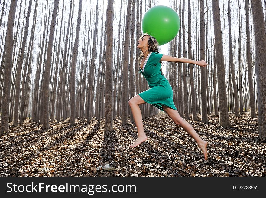 Beautiful Blonde Girl With Balloon In The Woods