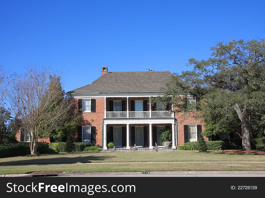 It is a red brick suburban house.