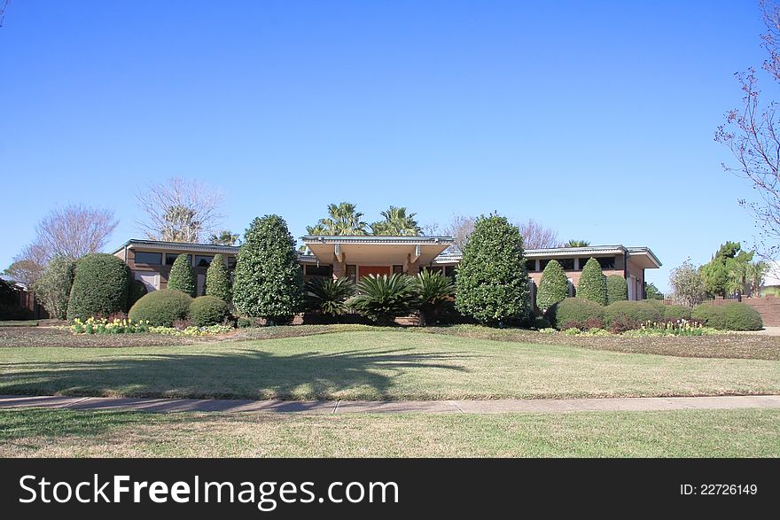 It is pretty garden in front of a house.