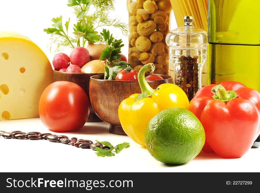 Vegetables , pasta, cheese and different spice,  on a white background. Vegetables , pasta, cheese and different spice,  on a white background