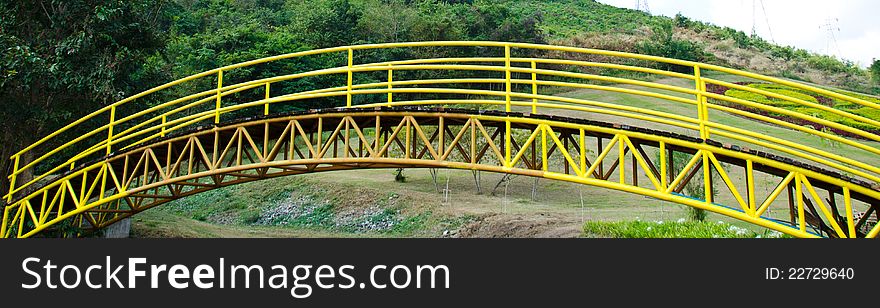 Yellow iron bridge in the park. Yellow iron bridge in the park.