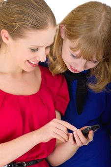Two Pretty Girls With A Mobile Phone Stock Image