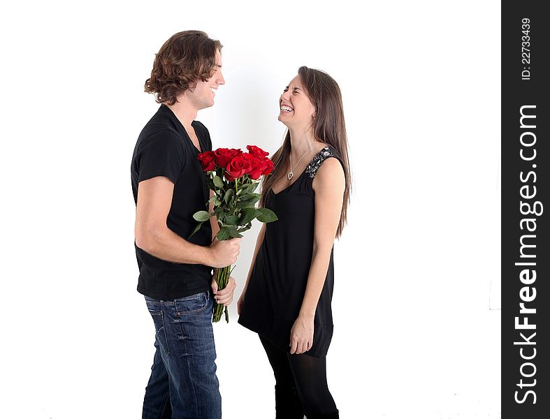 Pretty Brunette surprised with a Bouquet of long stem red roses. Pretty Brunette surprised with a Bouquet of long stem red roses