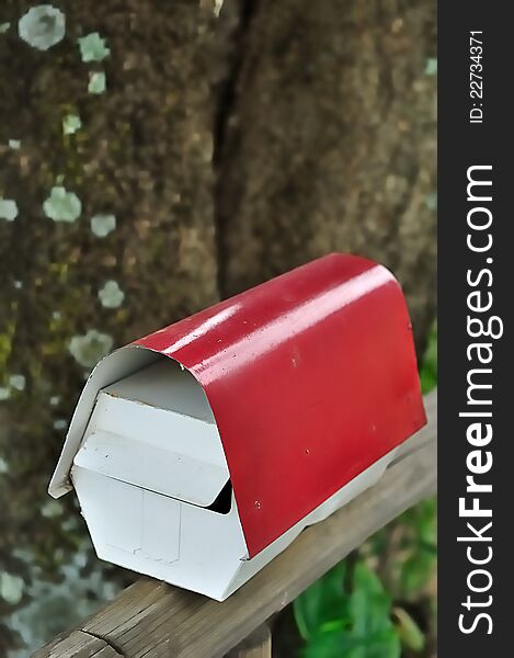 A post box in white and red