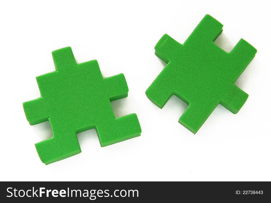 Two pieces of green puzzle