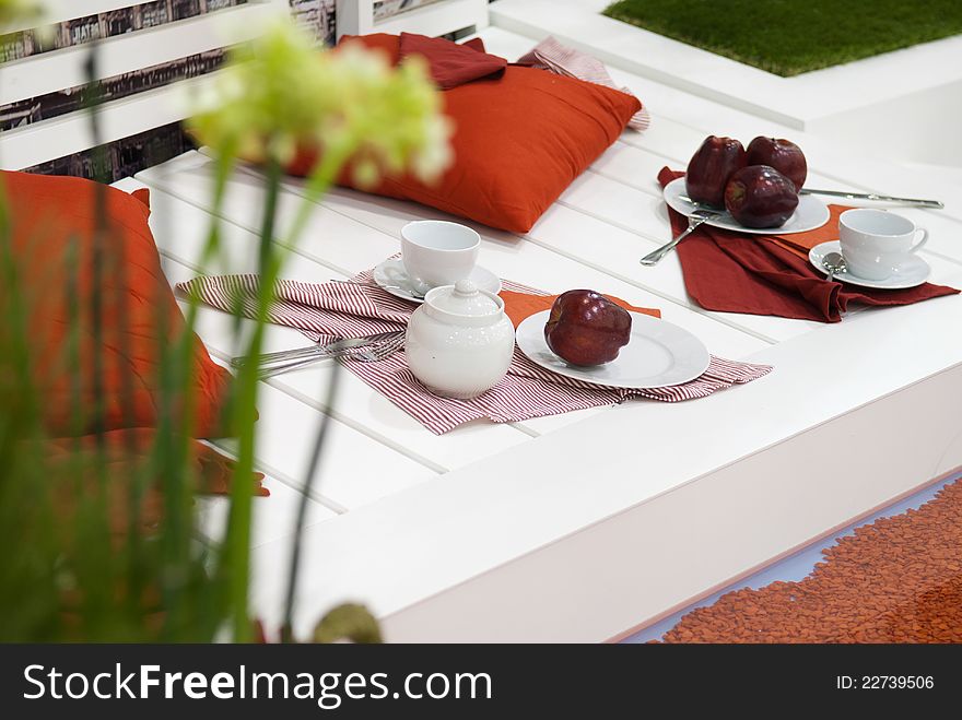 Red apples on the white deck