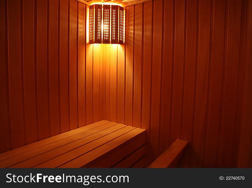 Light in the sauna is made of a wooden lamp