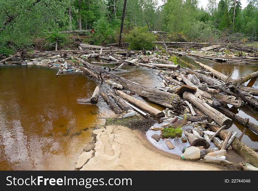 Jam from garbage and old trees on river in Western Siberia. Jam from garbage and old trees on river in Western Siberia.