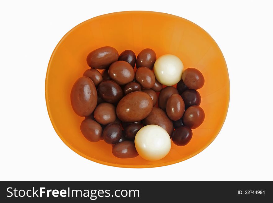 Chocolate candies with nuts inside im bowl