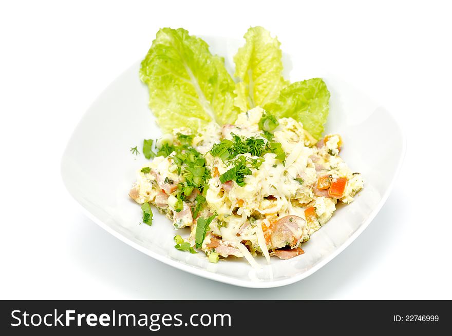 Salad with cheese, pepper, meat, spices and greens