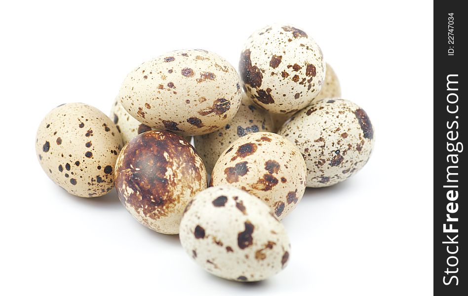 Quail eggs on white background