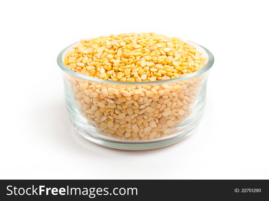 Collection of Dried uncooked mung or moong daal in transparent glass bowl