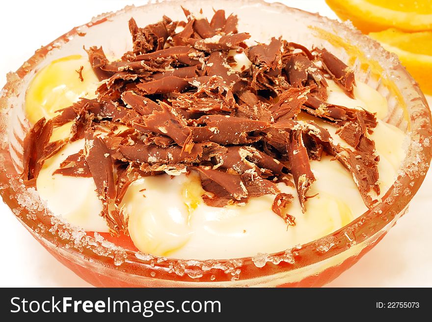 Yoghurt dessert with chocolate and fruit on a white background