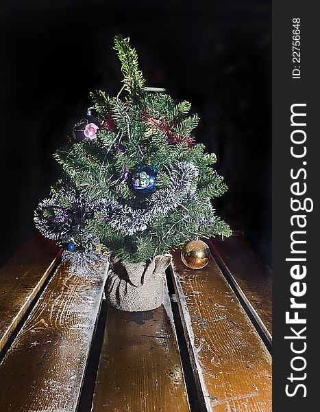 Decorative Christmas tree with decorations on the table