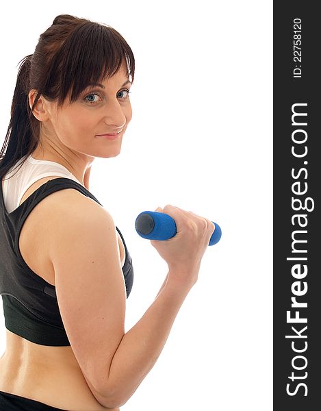 Woman is training with weights in a gym