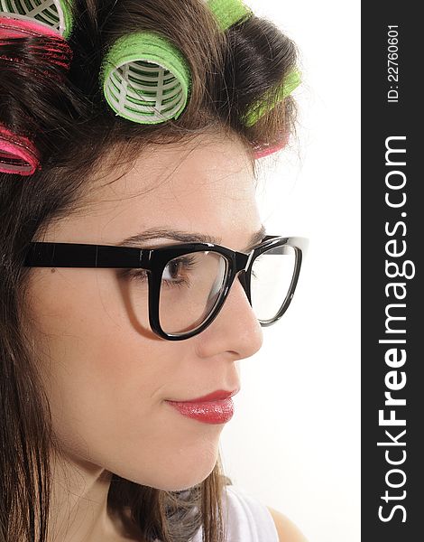 teenager girl model profile posing with colored curlers. teenager girl model profile posing with colored curlers