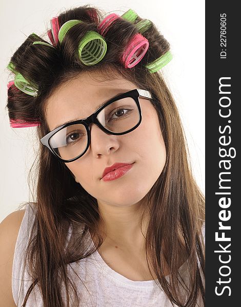 White beautiful girl profile posing with colored curlers. White beautiful girl profile posing with colored curlers