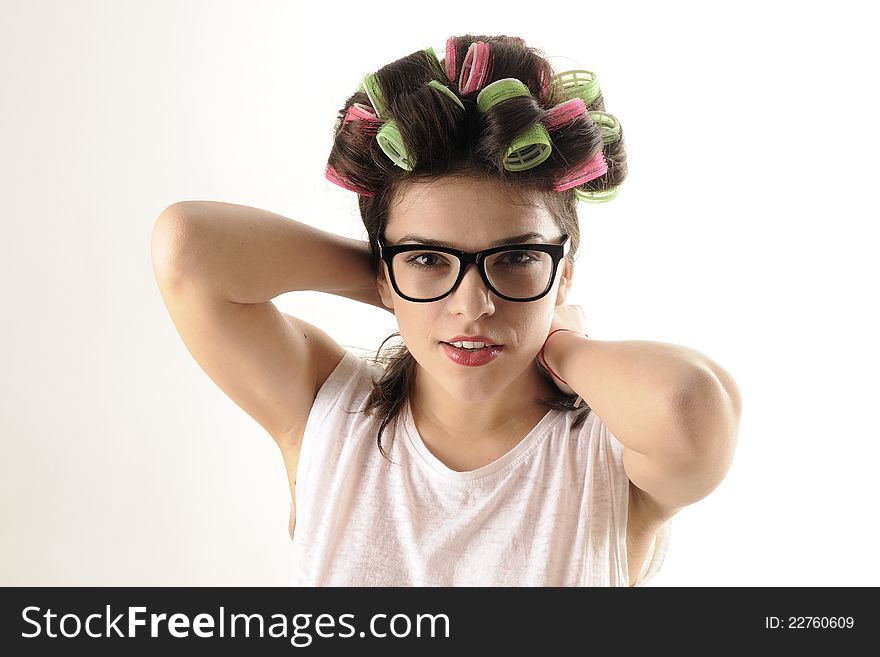 White beautiful girl profile posing with colored curlers. White beautiful girl profile posing with colored curlers