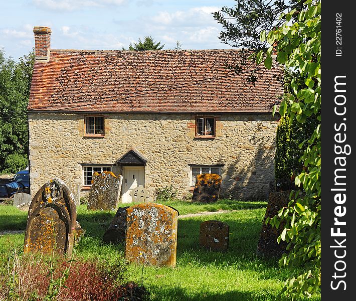 Traditional English Village Cottage viewed from the graveyard