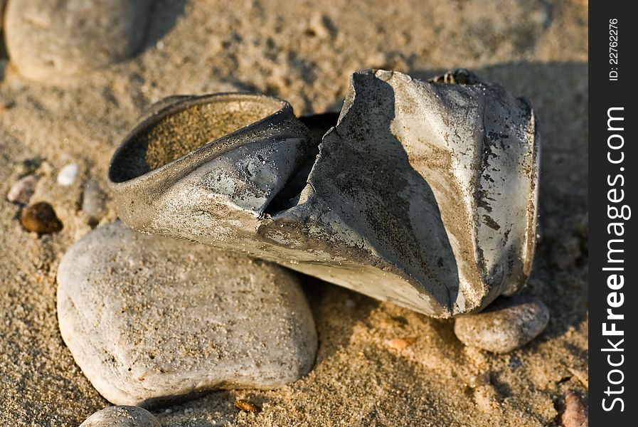 Aluminum can discarded on the beach