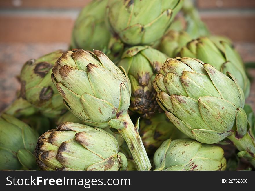 A macro raw artichokes, ready for cooking. A macro raw artichokes, ready for cooking
