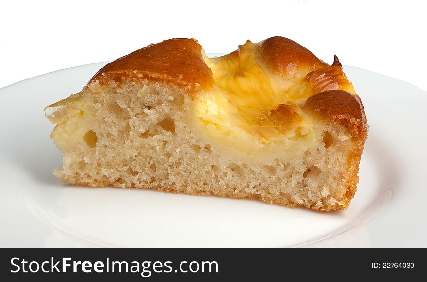 Piece of cake on plate isolated on white background