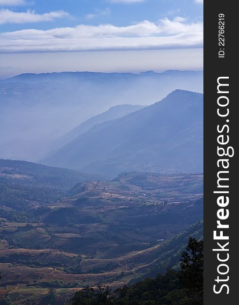 A mountain with blue fog on the morning. A mountain with blue fog on the morning