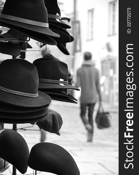 Hats for sale placed in a busy street