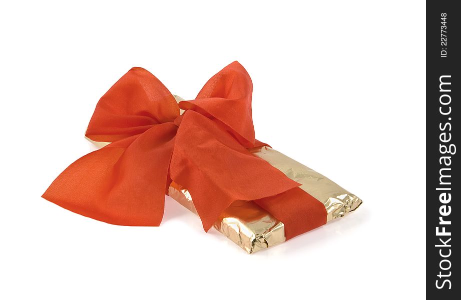 Red bow on the gold packing. Red bow on the gold packing
