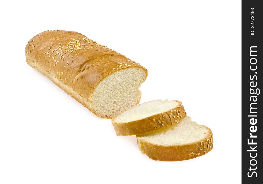 Baguette with the slices of bread on a white background. Baguette with the slices of bread on a white background