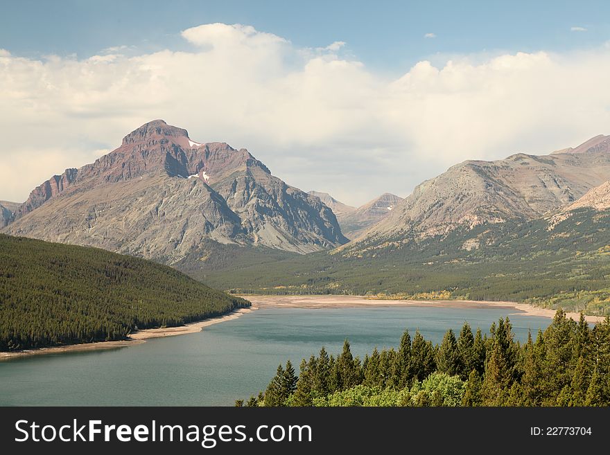 Mountain, Lake and Clouds at Glacier National Park. Mountain, Lake and Clouds at Glacier National Park