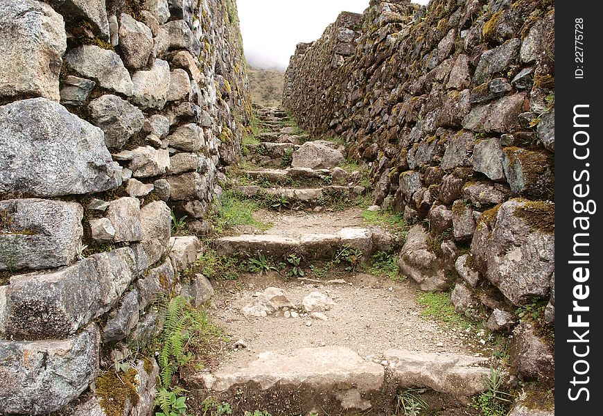 Inca trail between stone walls