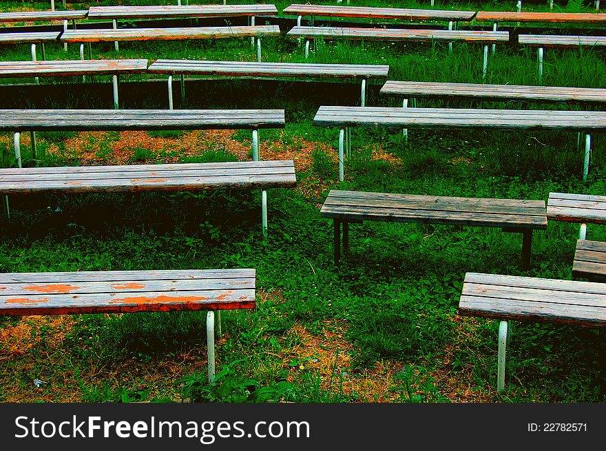 Benches in the park after a summer concert.