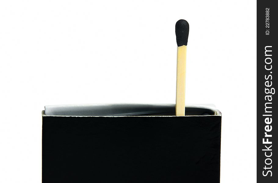 Black matches box and one match